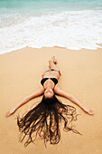 Hawaii, Oahu, Attractive young woman on the beach.
