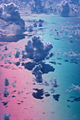 Special effect pink/blue sky, white puffy cumulus clouds, view from above A35D