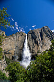 California, Yosemite National Park, Upper Falls come down rocks, blue skies B1643