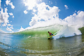 Hawaii, Maui, Maalaea, Professional Surfer Patri McLaughlin rides a wave at legendary surf break know as Freight Trains.