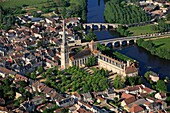 France, Vienna (86), Saint-Savin, a village famous for its Abbey of Saint-Savin sur Gartempe, World Heritage of Unesco, a bridge crosses the eleventh century Gartempe (aerial photo)