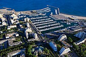 France, Hérault (34), La Grande Motte seaside resort, and large marina in the Mediterranean (aerial photo)