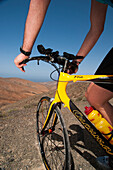 Man on a mountain bike, Los Morretes, Betancuria, Fuerteventura, Canary Islands, Spain, Europe