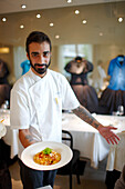Chef with plate of pasta, Restaurant in Hotel Maison Moschino, Via Monte Grappa 12, Milan, Italy
