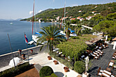 Terrace of hotel restaurant at the natural harbour, Hotel Sipan, Sipanska Luka, Sipan island, Elaphiti Islands, northwest of Dubrovnik, Croatia