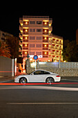 White Porsche at night in front of Energia Cocktail Bar and Lounge, Playas del Rey Boutique Hotel, Santa Ponsa, Mallorca, Balearic Islands, Spain