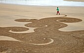 Sand drawing, Beach, Hendaye, Aquitaine, Pyrenees Atlantiques, France.