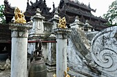 Shwenandaw Monastery or Golden Palace Monastery is a historical monastery located near Mandalay Hill  It was built by King Mindon in the 19th century  It is known for its teak carvings of Buddhist myths, which adorn its walls and roofs  The monastery is b