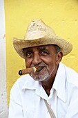 Cuban man smoking a cigar in Trinidad,Sancti Spiritus Province,Cuba