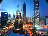 The construction of the Shanghai Tower in Shanghai, China next to the Shanghai World Financial Center and the Jin Mao Tower