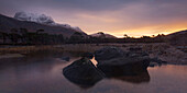 Sunrise above the Northwest Highlands with the view to the summit of Slioch and Loch Maree in the foreground, Scotland, United Kingdom