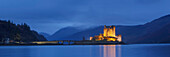 Panorama of the medieval Eilean Donan Castle in Loch Duich with mountains in the background, Dornie, Scotland, United Kingdom