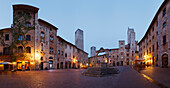 Towers and fountain on Piazza della Cisterna square, San Gimignano, hill town, UNESCO World Heritage Site, province of Siena, Tuscany, Italy, Europe