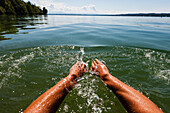 Man swimming in lake Starnberg, Bavaria, Germany