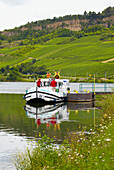 Houseboat with crew at the moorings of Nittel, Dolomitfelsen, Mosel, Germany and Luxembourg, Germany, Luxembourg, Europe