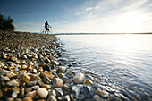 Man cyclocross touring in autumn, Lake Starnberg, Ambach, Munsing, Bavaria, Germany