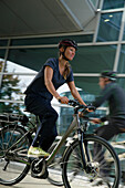 Woman riding an e-bike, Munich, Bavaria, Germany