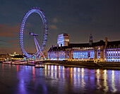 London Eye seen over the river Thames river near the County Hall and aquarium, London, England