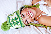 Young woman wearing a woolly hat looking at camera, Styria, Austria