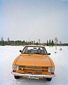 FINLAND, Rovaniemi, man sitting in a vintage car