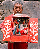 PERU, Urubamba, South America, Latin America, mature man holding a sacred object