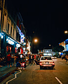 SINGAPORE, Asia, people waiting outside bar at Mohammed Sultan road at night