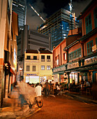 SINGAPORE, Boat Quay, tourists sitting in font of restaurant at night