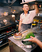 SINGAPORE, Asia, chef working at the Newton Food Court kitchen