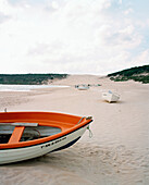 SPAIN, Andalusia, Tarifa, boats on sand at beach