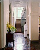 SRI LANKA, Asia, Galle, butler standing inside the Amangalla Hotel
