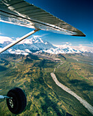 USA, Alaska, Denali National Park, airplane wing with view of Mount Denali