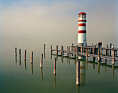 AUSTRIA, Podersdorf, people visit a lighthouse in the fog, Lake Neusiedler See, Burgenland