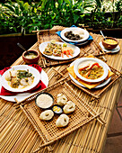 BRAZIL, Belem, South America, food plates on wicked trays and table, La Em Casa
