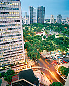 BRAZIL, Belem, South America, urban view of city skyscrapers with vehicles moving on street at dusk