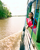 BRAZIL, Belem, South America, teenage girl traveling on boat to Coboclos, Baia do Guajara