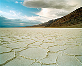 USA, California, badwater salt flats with mountains in the background, Death Valley National Park