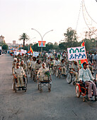 ERITREA, Asmara, Eritrean war veterans march during the Independence Day Celebrations, Liberation Avenue