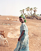ERITREA, Beilul, a young Afar girl tends to her livestock in Dad Village
