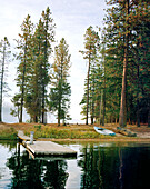 USA, Idaho, pier and sailboat, Priest Lake