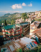 INDIA, West Bengal, residential buildings in Darjeeling with the Himalayas in the background