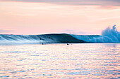 INDONESIA, Mentawai Islands, Kandui Resort, surfing Bankvaults at dusk, Indian Ocean
