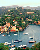 ITALY, Europe, elevated view of sailboats and the seaside town of Portofino