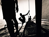MADAGASCAR, Anjajavy, fisherman in pirogue sailing back to their village at the end of the day
