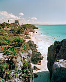 MEXICO, Maya Riviera, Tulum Ruins and beach with swimmers
