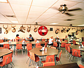 USA, Texas, people eating at Zimmerhanzel's Bar-B-Que restaurant, Smithville