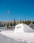 USA, Utah, male skier in midair gap jump, Park City Ski Resort