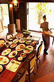 VIETNAM, Hue, a table is set for an early dinner at Ms. Boi Trans home in Hue