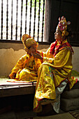 VIETNAM, Hue, Tu Duc Tomb, dancer Ms. Nguyen Ngoc Thien and her son dress in traditional Vietnamese costume and prepare for a performance