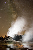 USA, Wyoming, Yellowstone National Park, geysers steam at Old Faithful Geyser Park at night