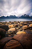 Long exposure on the Lyngen Fjord with snow-capped peaks of the Lyngen Alps in the background, Troms, Norway
